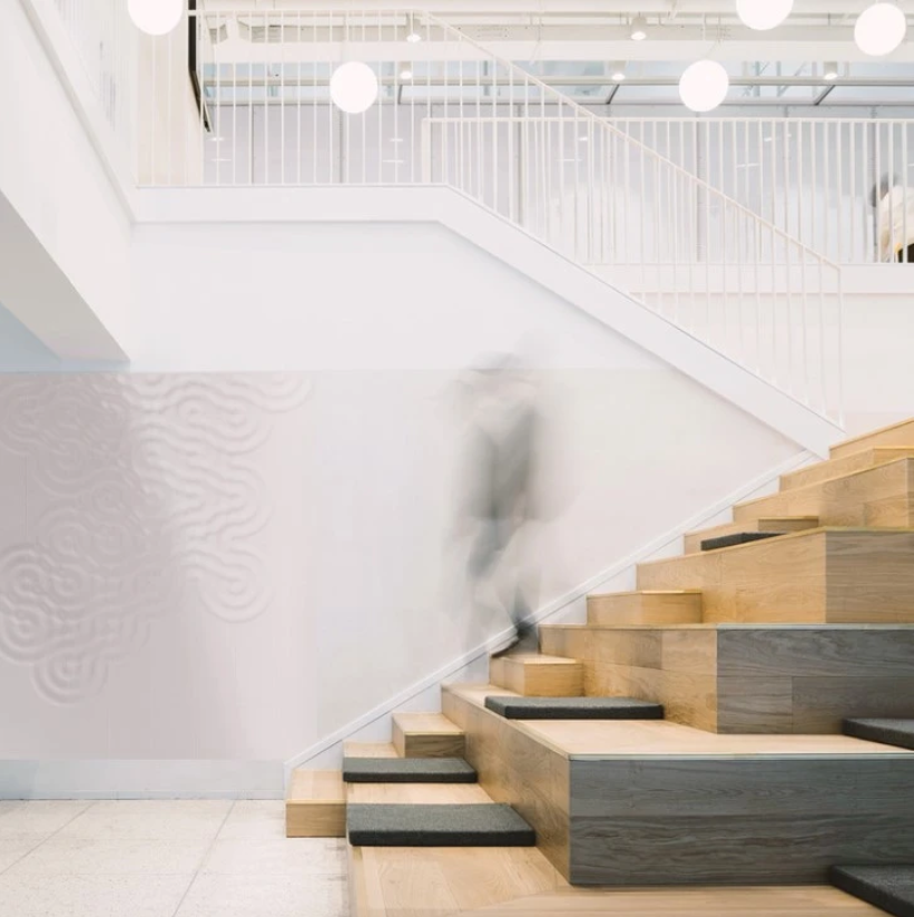 Wav concrete tile design wall blended into staircase space by Musca